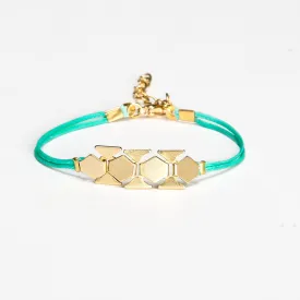 Turquoise cord bracelet with a gold chunky flat chain